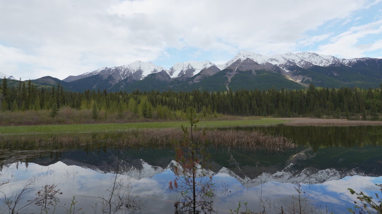Dog Lake mountains reflecting in Kootenay National Park water in Canada