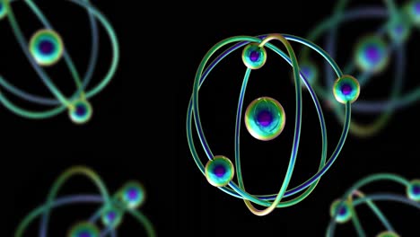 animation of atom models spinning on black background