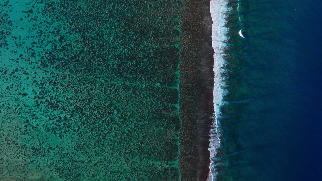 Bora Bora Moorea Mo'orea Tahiti French Polynesia aerial drone birdseye unique birdseye perspective wave surf crashes on coral reef passe channel fingers deep aqua blue South Pacific island forward
