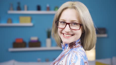 Young-blonde-woman-smiling-at-camera.-Positive-image.