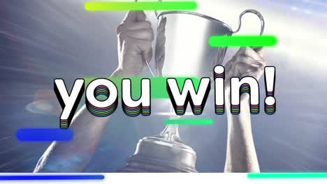 animation of you win text in rainbow coloured letters and stripes over man holding silver cup