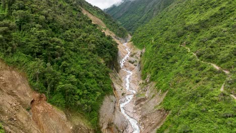 Aerial-drone-view-of-Urubamba-river-crossing-the-jungle,-close-to-Machu-Picchu-Pueblo,-sacred-valley,-Cusco-region,-Andes,-Peru,-South-America