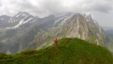 a man running on top of a mountain