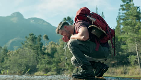 drinking water, hiking or man by river in nature