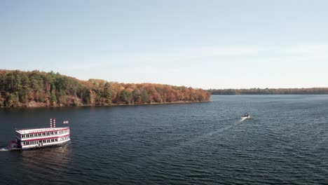 river boat on au sable river in michigan with drone video sideways