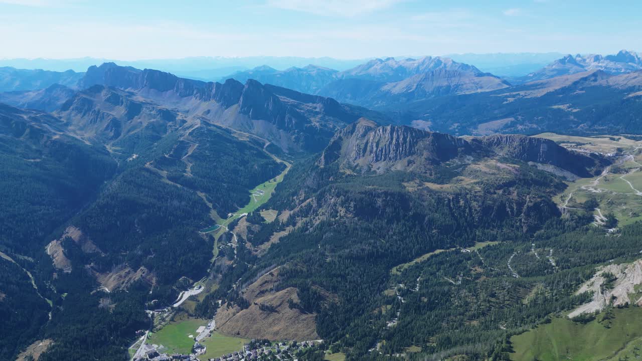 Drone footage of the Pale di San Martino in the Dolomites, Italy: majestic peaks, rocky spires, alpine meadows, and dramatic landscapes ideal for travel, nature, and adventure projects