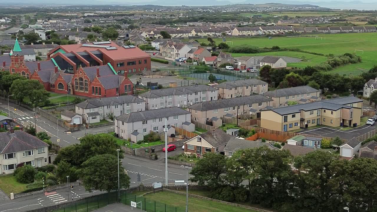 Holyhead residential district properties aerial view overlooking neighbourhood church and school