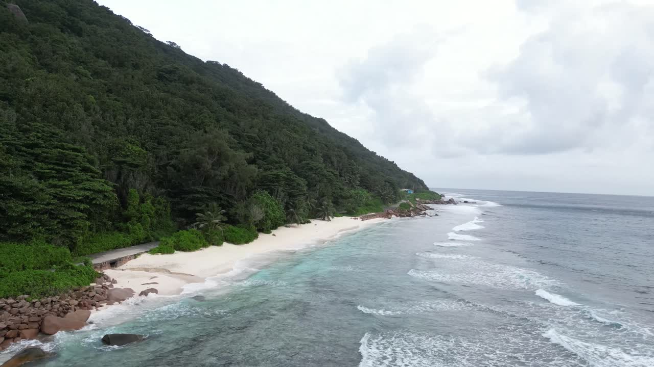 drone above tropical scenic coastline white sand beach in La Digue Island, Seychelles archipelago Indian Ocean