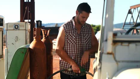 man filing petrol 4k