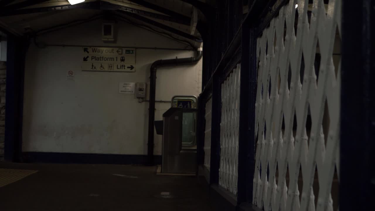 Walking along lonely empty railway bridge medium shot