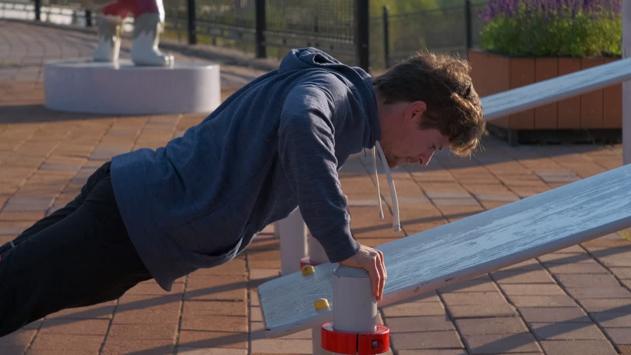 Man Doing Push-ups at Outdoor Gym