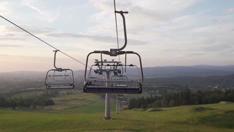 summer panorama with empty ski lift, panning left