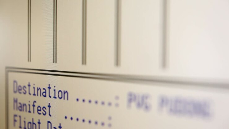 Close-up of a blurred monitor displaying statistical data