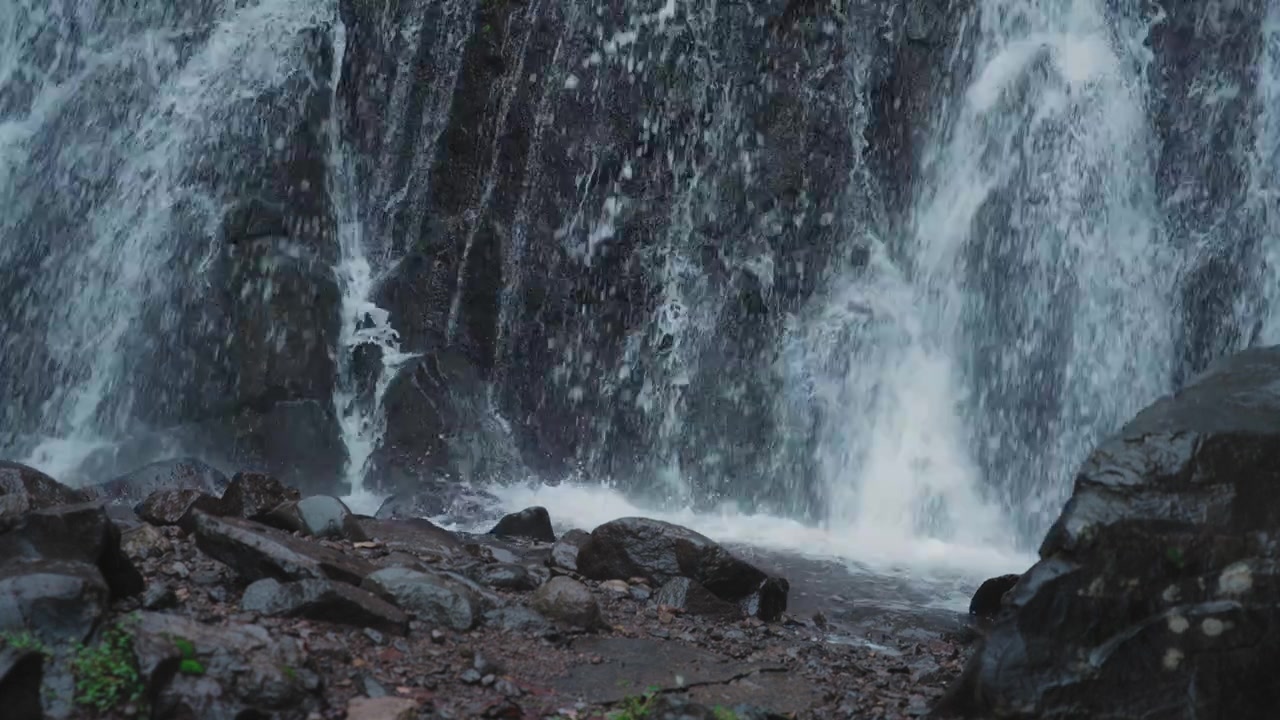 Waterfall crashes into the river