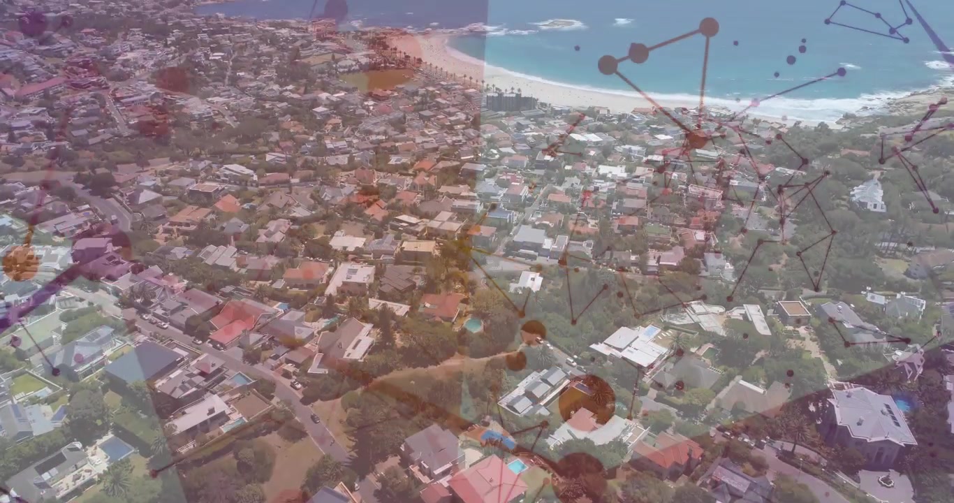La telecamera si allontana rivelando tetti dall'alto, con panoramica mentre i nodi si spostano, mappando la rete costiera.