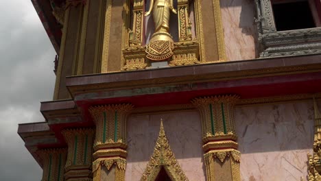 chalong temple golden buddha statue tilt shot