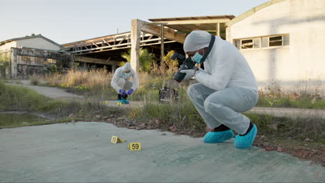 forensic investigators documenting a crime scene