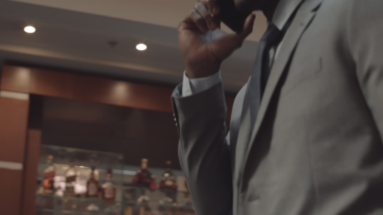 Two Confident Men Talking on Phone