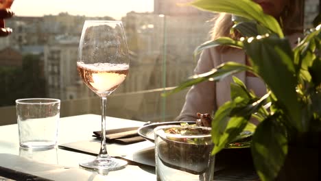 rooftop dining with rose wine and city views