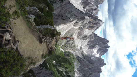 Beautiful-blonde-girl-hiking-on-the-top-of-Cadini-Di-Misurina-Viewpoint,-Dolomites,-Italy,-Europe