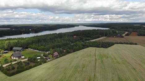 high-altitude flight over lake jezioro gwiazdy and borowy młyn village in kaszuby, pomeranian voivodeship, poland