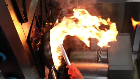 a chief cooks food on a grill close up shot, insert shot, vertical video