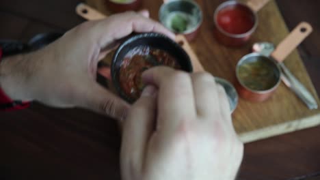 tasting various sauces