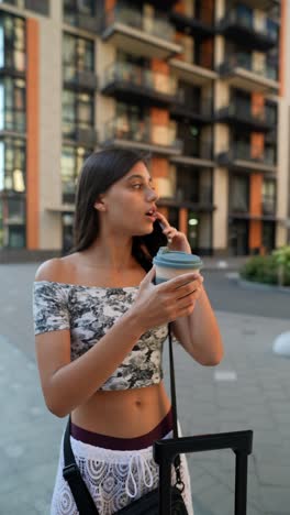 young woman talking on phone while traveling