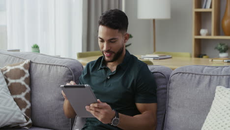 happy, relaxed and carefree man with a tablet