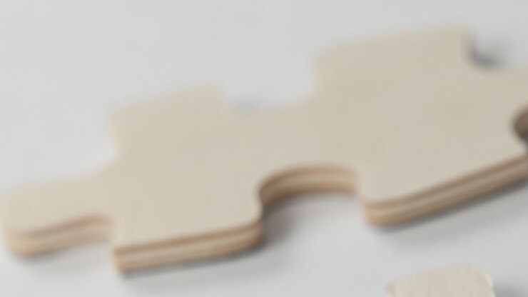 Animation of wooden piece of puzzle over white background