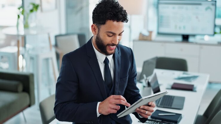Businessman Using Tablet in Modern Office
