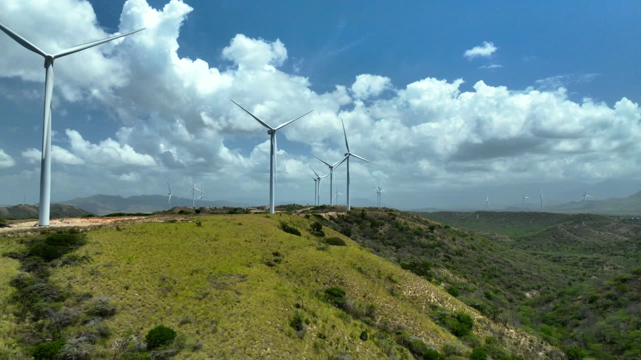 Aerial View of Wind Turbines on a Hilly Landscape