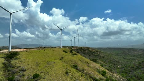 aerial view of wind turbines on a hilly landscape