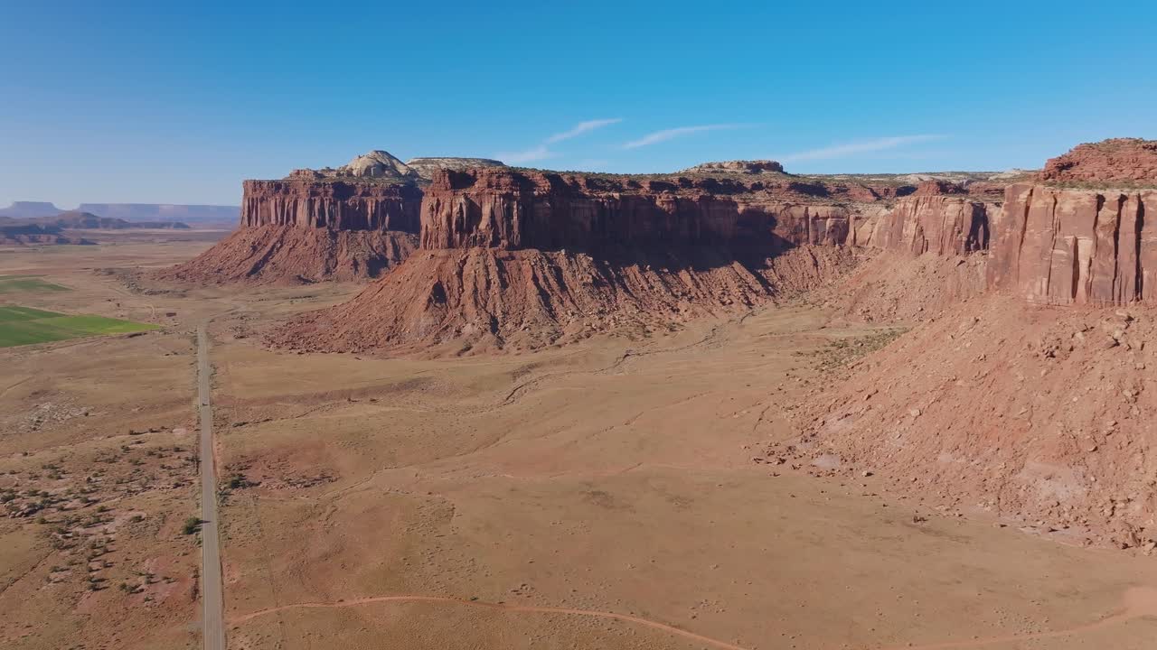 Vast red rock landscape in Moab, Indian Creek under clear blue sky