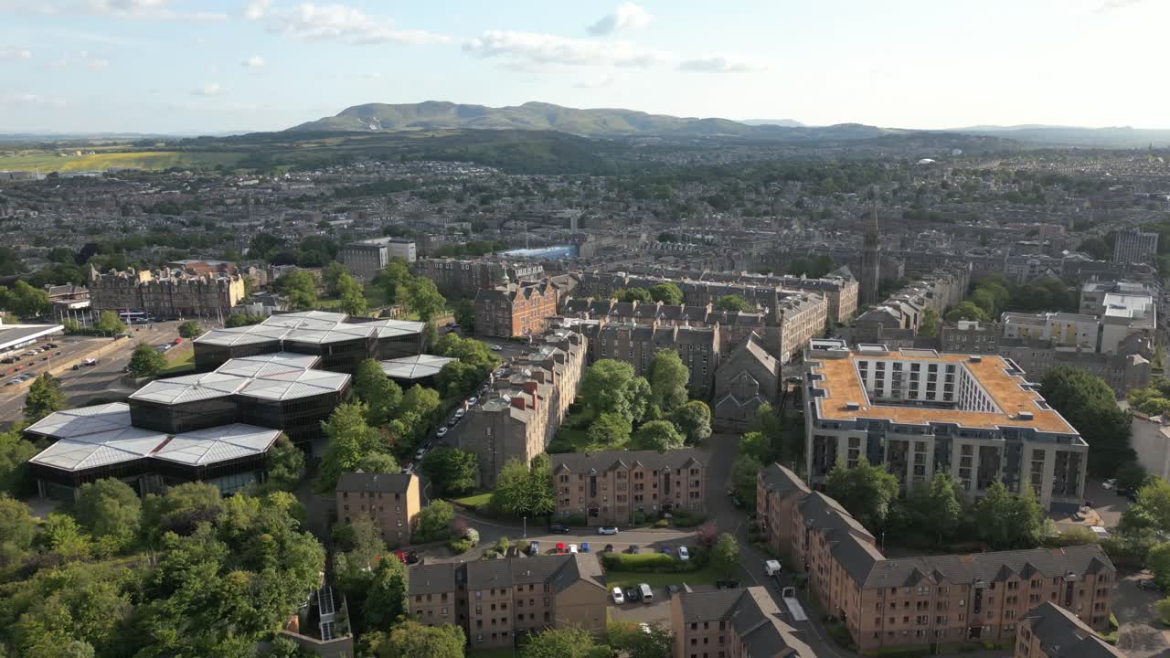 Aerial rise of south side of Edinburgh city centre with office buildings and dormitory, Edinburgh, Scotland, UK