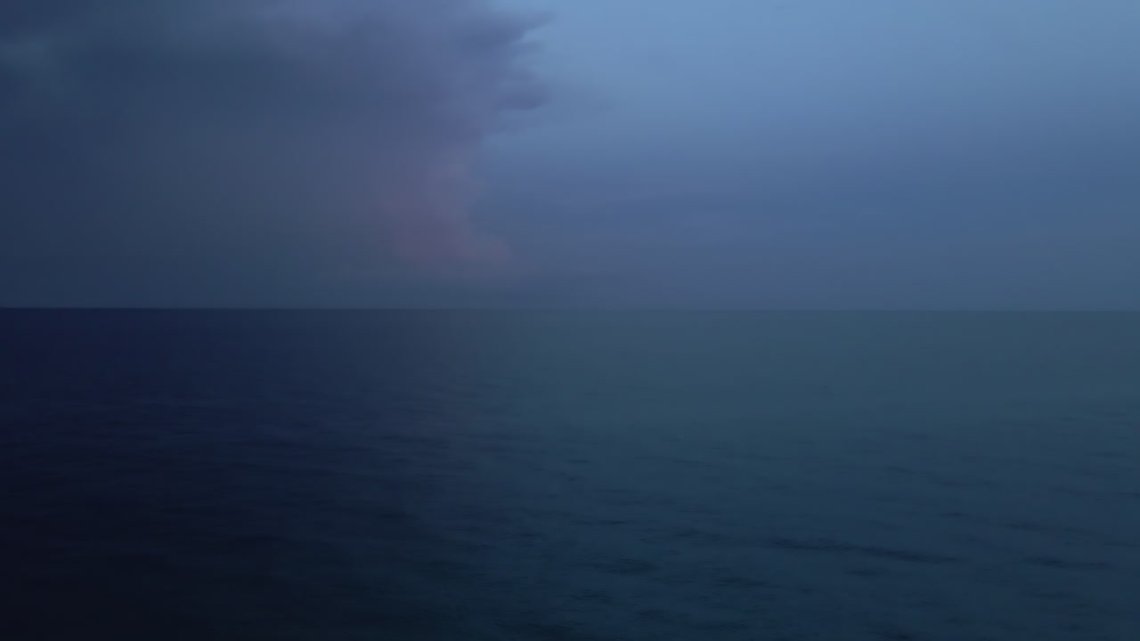 Surreal and ethereal blue on deep blue evening ocean background scene