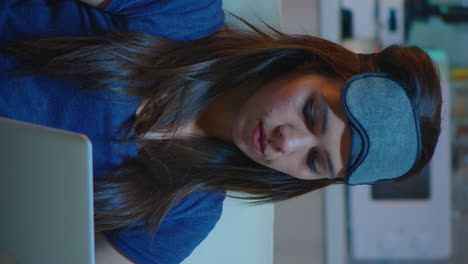 vertical video: portrait of woman working at laptop