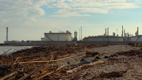 timelapse footage of a fuel refinery near the sea, pollution concept