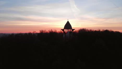 aerial ascending view of religious viewpoint, sunrise flickering through balcony