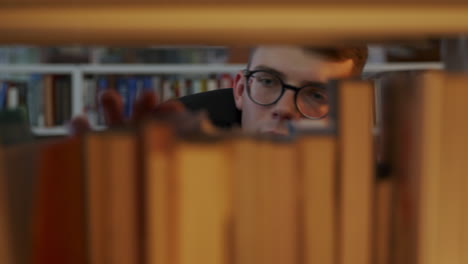 student looking for a book in the library