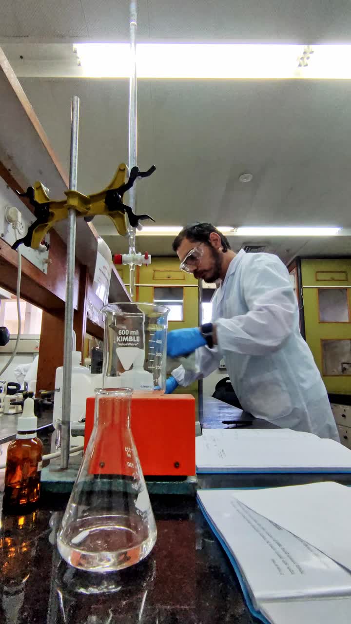 Scientist conducting experiment in a chemistry lab