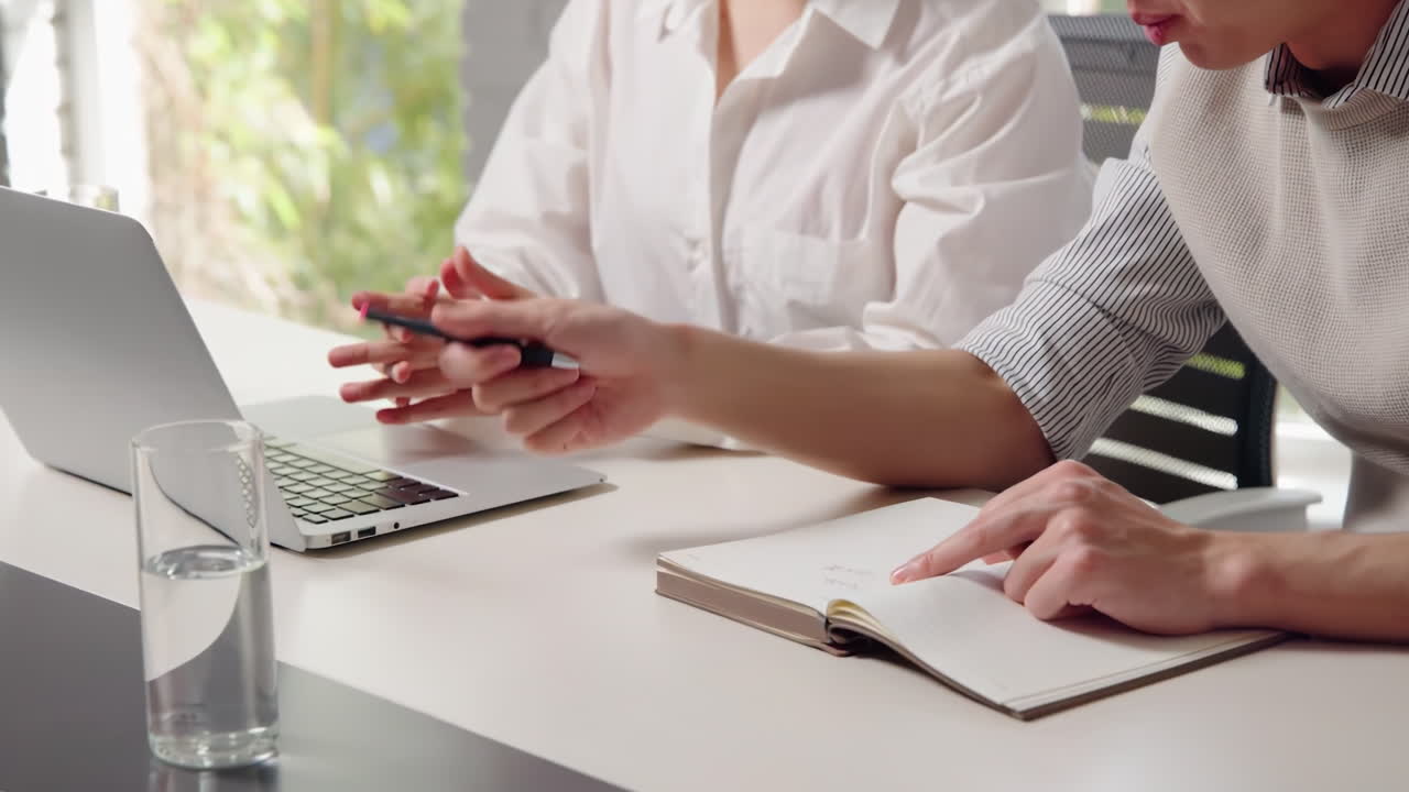 Teammate coworkers gather in boardroom discuss ideas in group at briefing about discussing investment portfolio, planning and analyzing strategies with client