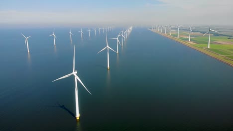 windmill turbines, offshore windmill farm in the ocean westermeerwind park , windmills isolated at sea on a beautiful bright day netherlands flevoland noordoostpolder