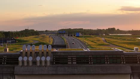 aerial reveal, riverbank, tunnel structure, transportation a15 motorway