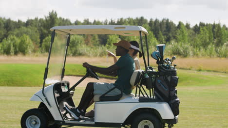 Caucasian-woman-and-african-american-man-on-the-golf-course.