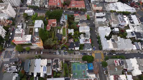 dolly left aerial directly above lombard street as cars weave down winding road