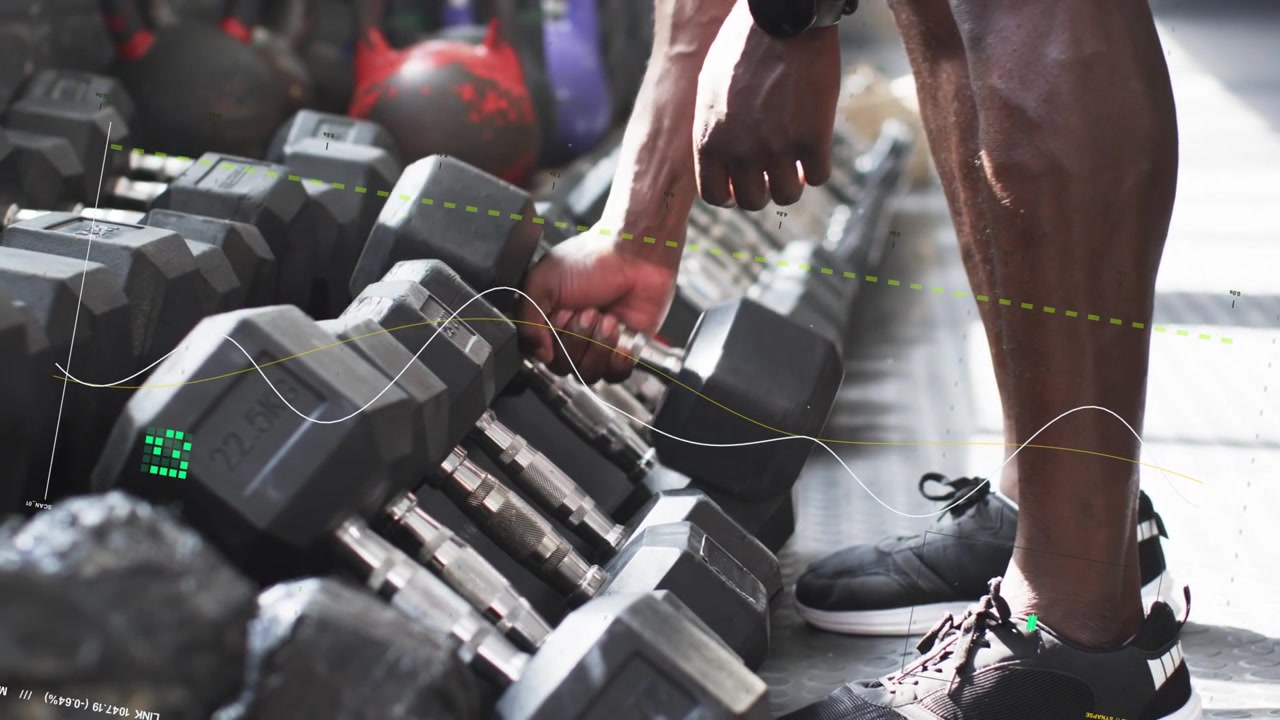 Man shifting weight, reaching and gripping midweight hex dumbbell beside rack for fitness