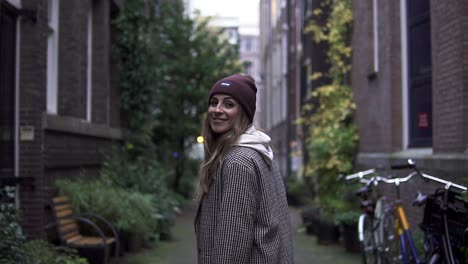 happy and confident smiling girlfriend woman looking into the camera in a street