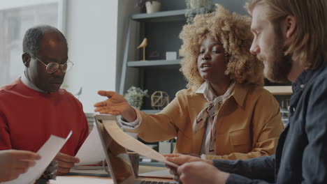 black businesswoman holding office meeting with team