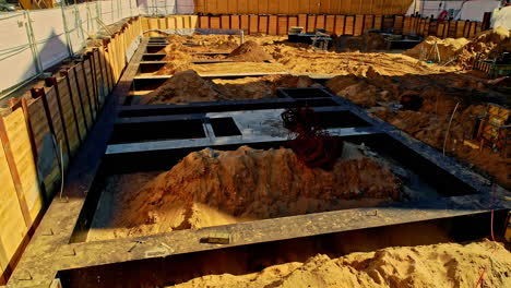 Construction Site Foundation With Backfill. ascending drone shot